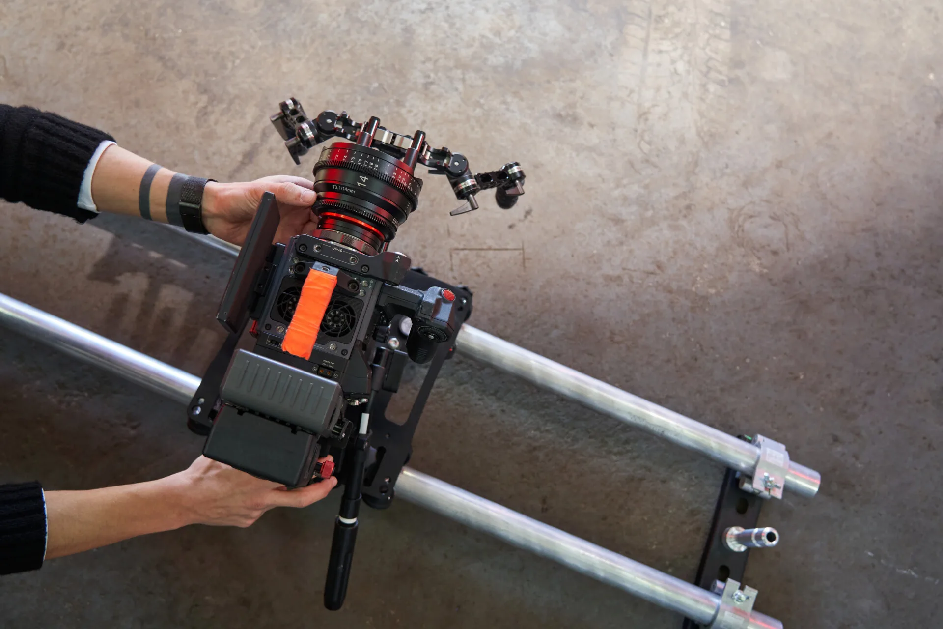 male-hands-of-a-videographer-roll-and-set-up-a-pro-2023-11-27-05-21-10-utc